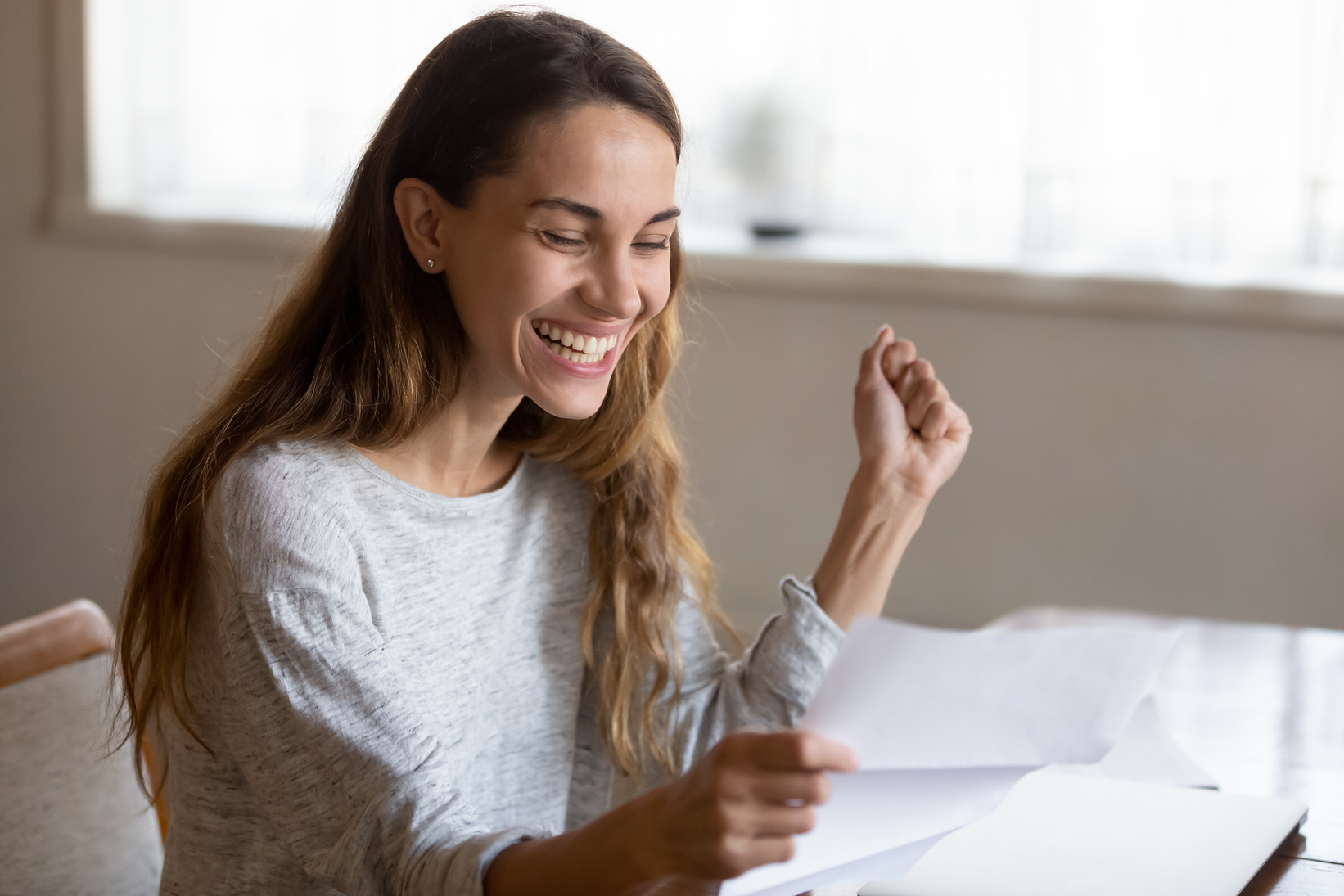 Happy Woman Reading Letter